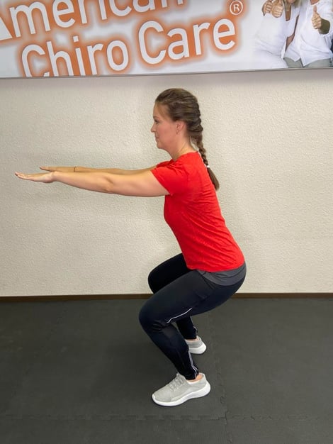 Core Stability Übung Kniebeugen American Chiro Care Bonn